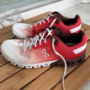 On Running Red and White Athletic Shoes